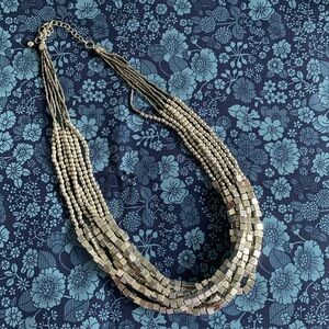 Beautiful 7 strand silver beaded necklace. Maximum length is 22” total. EUC.